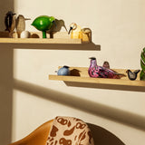 Oiva Toikka glass birds displayed on wooden shelf