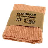folded household cloth in dusty pink by Iris Hantverk on white background