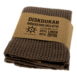 Folded brown mole coloured household cloth by Iris Hantverk, white background