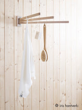 Iris Hantverk soap on a rope hanging on wooden towel rail