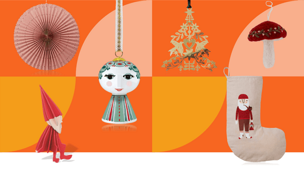 Scandinavian folk Christmas decorations including red paper rosette, ceramic bell-shaped ornament with folk patterns, gold folk tree decoration, embroidered felt mushroom, Nordic pixie figure and playful Christmas stocking on orange and yellow background