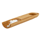 Iris Hantverk wooden salt scoop with a small amount of salt on a white background