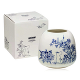 white ceramic vase with blue floral and Moomin design, next to its packaging box.