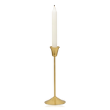 A small-sized slim brass Ria candle holder from Broste Copenhagen with a single white taper candle, shown against a plain white background.