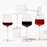 group of 5 iittala Finland Essence Clear wine glasses on a white background