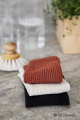 Folded brown household cloths by Iris Hantverk, lifestyle kitchen